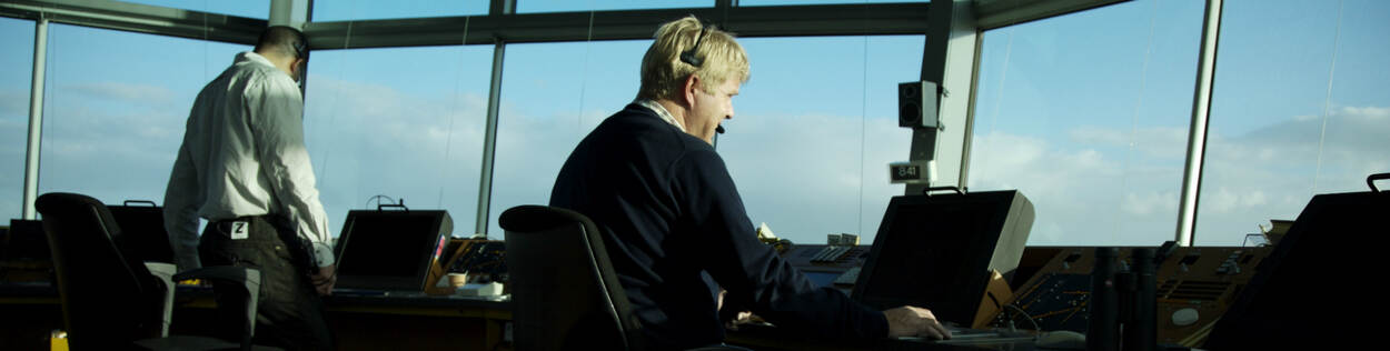 Two air traffic controllers working in control tower in the Netherlands