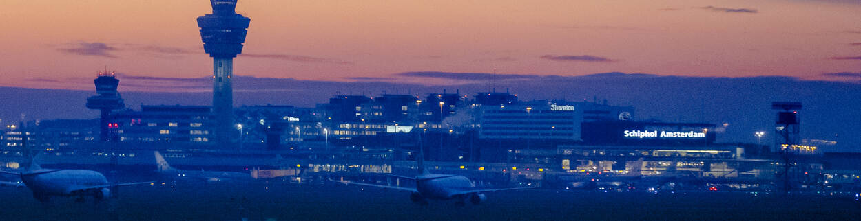 Panorama of Schiphol Amsterdam Airport at dusk